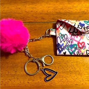 Pink coin pouch keychain with poof